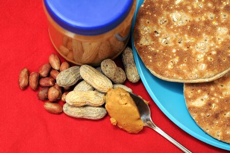 peanut butter jar and bagel on dish