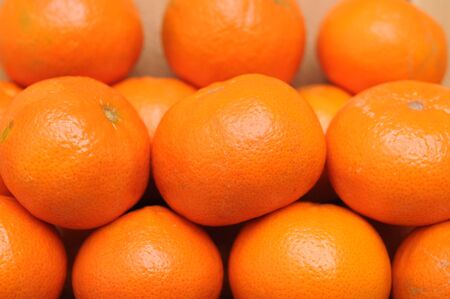 many tangerines  for background usesの写真素材