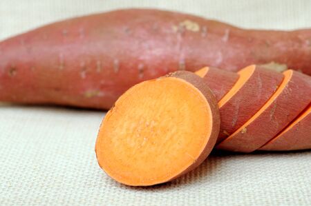 sliced sweet potato on burlapの写真素材