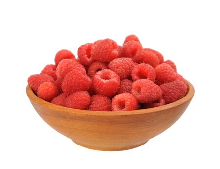 raspberry in wooden bowl isolated on white background