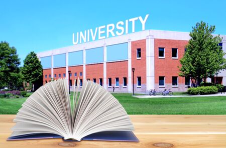 open book on the wooden table in the university campusの写真素材