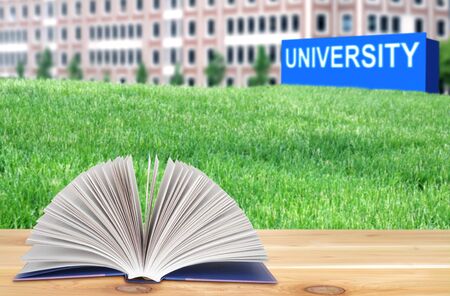 open book on the wooden table in the university campusの写真素材