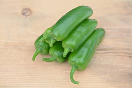sliced Jalapeno Peppers  on wooden cutting board 