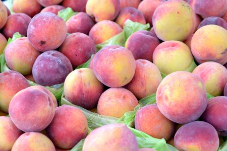 fresh organic peach at the famers market placeの写真素材