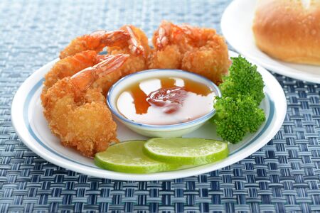 coconut shrimp with sauce and vegetable in plate 