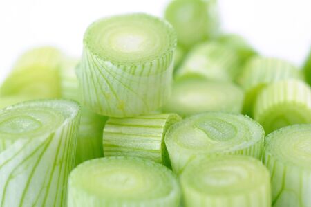 closeup sliced fresh onion leaf on white background の写真素材