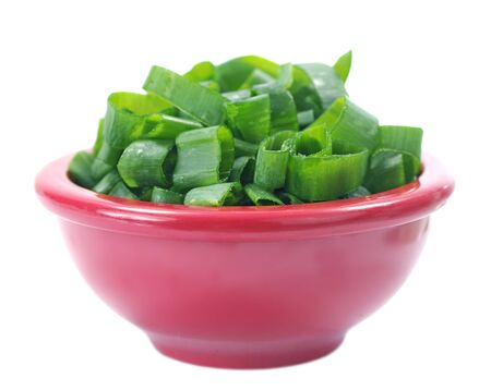 sliced onion leaf in mini plastic bowl isolated on whiteの写真素材