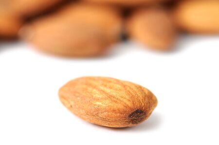closeup of almond on white (shallow deep of field) の写真素材