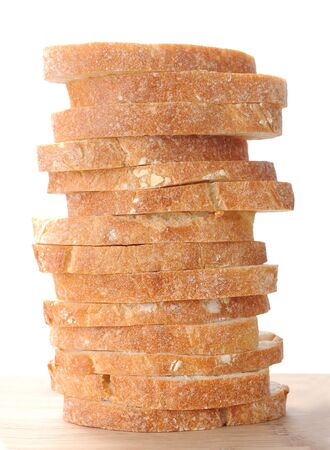 sliced ciabatta flat bread on cutting boardの写真素材
