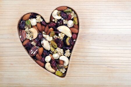honey roasted nut in heart frame for Valentine Dayの写真素材
