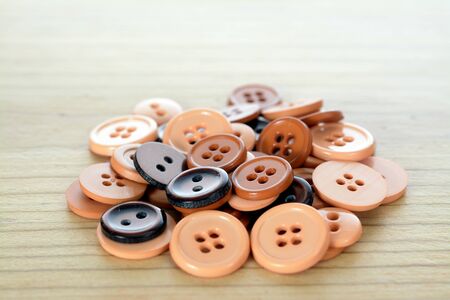 a lot of brown nuts on wooden table