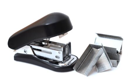 a lot of staple and stapler on white background の写真素材