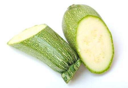 cutting  marrow zucchini isolated on white background の写真素材