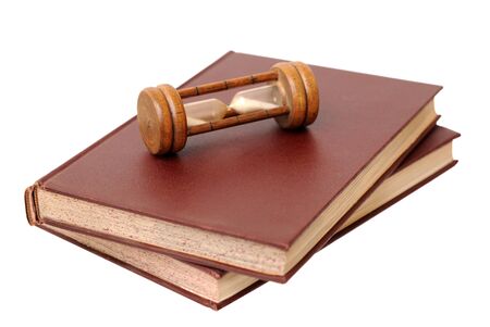 two antique books and sand clock isolated on a white backgroundの写真素材