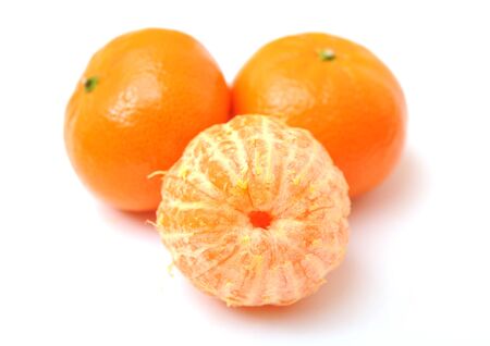 three clementines on white backgroundの写真素材