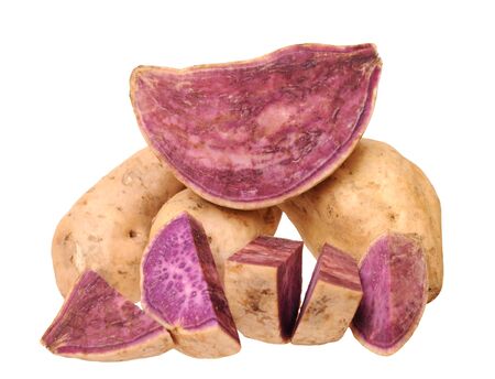 cutting and whole purple sweet potato isolated on white backgroundの写真素材