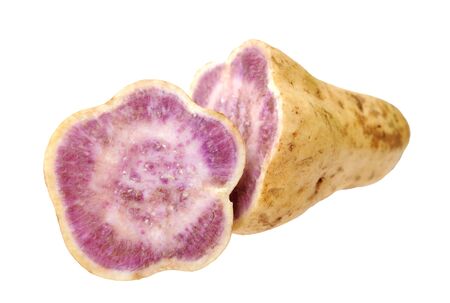 cutting purple sweet potatoes isolate on white backgroundの写真素材