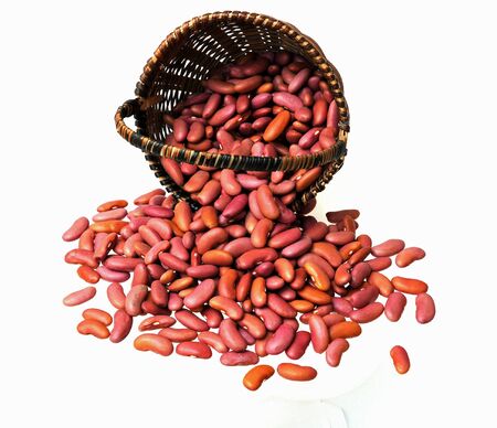 dried light red beans in bamboo basket