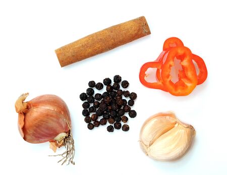 onion, cinnamon, sweet pepper, garlic and pepper on white background
