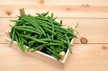 a lot og green beans in wooden caseの写真素材