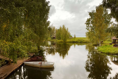 Boats on tranquil lake, Kostroma, Russiaの写真素材