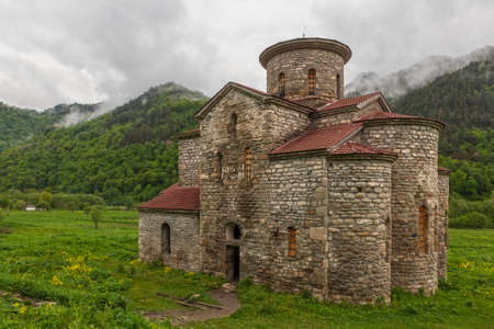 Central Church of Zelenchuksky Churches under heavy sky around the ruins of Nizhnearkhyzskoe...