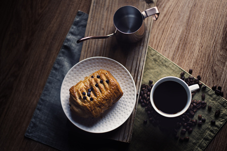 Black coffee and croissant bread breakfast