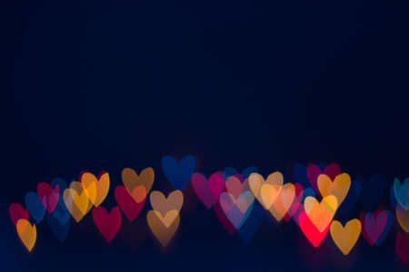 Heart shape lights line on dark blue backgroundの写真素材