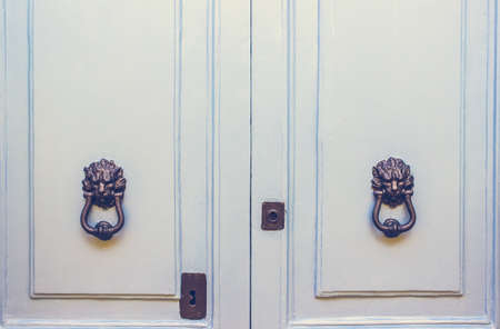 A Pair of Old Metal Lion Head Knockers on Light Blue Doors in Mdina, Maltaの写真素材