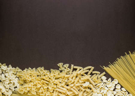 Mixed dried pasta selection with space for your text. Top view shotの写真素材
