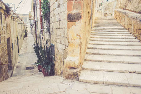 Stairs on the street of la Valletta, Malta. Two different ways to choose. Moving up to Success conceptの写真素材