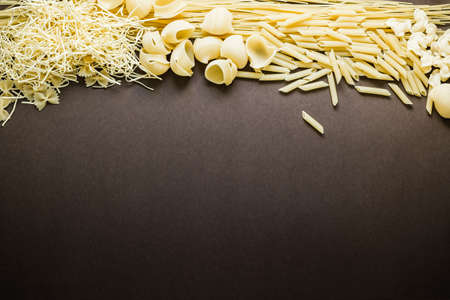 Mixed dried pasta selection with space for your text. Top view shotの写真素材