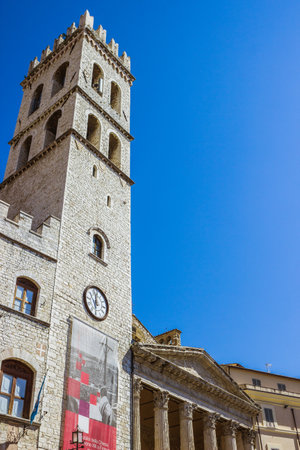 ASSISI, ITALY - SEPTEMBER, 4, 2016: Palace of the People's Captain (Capitano del Popolo), Town Hall tower and the temple of Minerva on the Municipality Square (Piazza del Comune) in the old town of Assisi, region of Umbria, Italyのeditorial素材