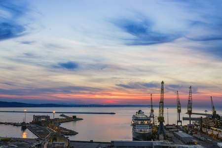Industrial commercial port at sunset, Ancona, Italy. View from the hillの写真素材