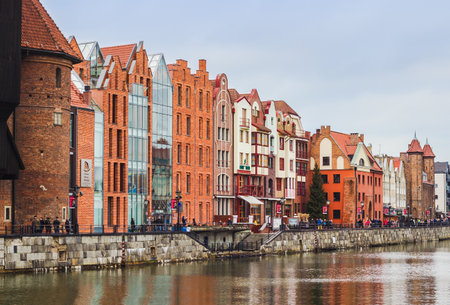 GDANSK, POLAND - JANUARY 1, 2015: Old and modern architecture over the Motlawa river, the Old Town...