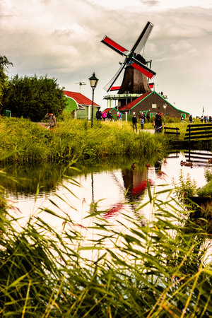 ZAANSE SCHANS, NETHERLANDS - AUGUST 24, 2014: Nature and windmills in Zaanse Schans, North Holland, Netherlands. Popular tourist destination in Netherlandsのeditorial素材