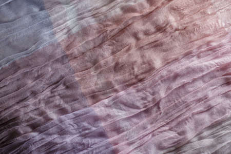Gradient purple, pink, beige cloth textile texture backgroundの写真素材
