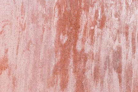 Old red painted wall with rust texture. Grunge rusted metal background. Rust stains.