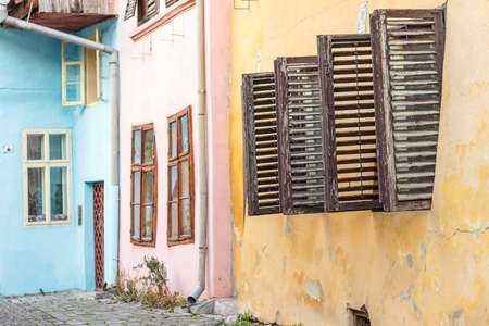 Street view of Sighisoara with colorful little houses, Transylvania, Romaniaの写真素材