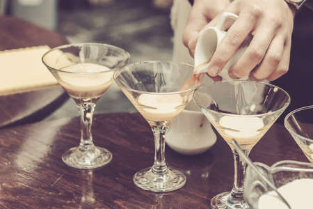 Bartender making espresso coffee based cocktail in cafe or restaurantの写真素材