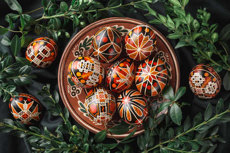 Pysanky on a plate, Ukrainian Easter eggs decorated with wax-resist dyeing technique, traditional for Eastern European countriesの写真素材