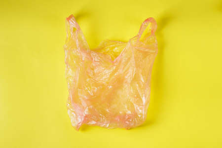 Square photo of the White Wrinkled Plastic Bag On Purple Backgroundの写真素材