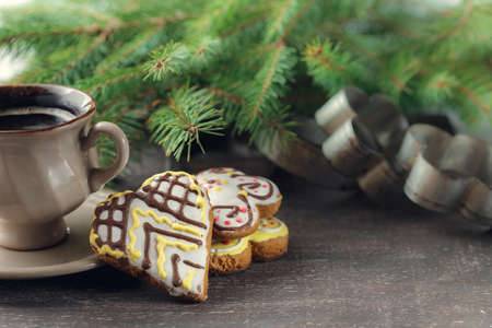 Cup of black coffee with christmas tree and gingerbread cookies, top viewの写真素材