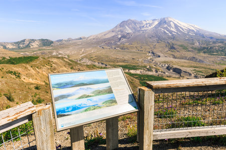 Washington state, USA - June 24, 2018: View on Mount St. Helens and the valley at the foot with an information sign in the foregroundのeditorial素材