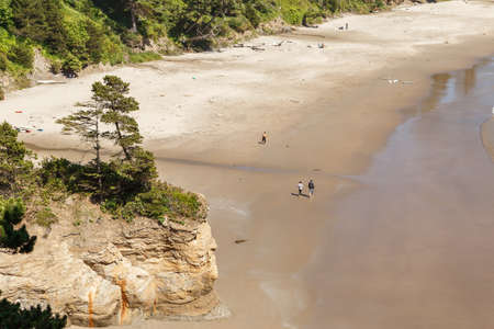 High angle view on Sandy Beach with few people walking at Pacific Ocean Coastline, Oregon, USAの写真素材