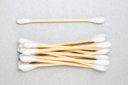 Bamboo cotton swabs on grey background. Zero Waste, plastic free lifestyle conceptの写真素材