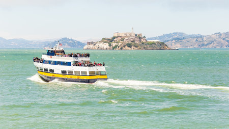 SAN FRANCISCO, CALIFORNIA, USA - July 24, 2018: View of the Alcatraz cruize boat with the tourists going to visit Alcatraz Island. Alcatraz was a federal prison from 1934 to 1963.のeditorial素材