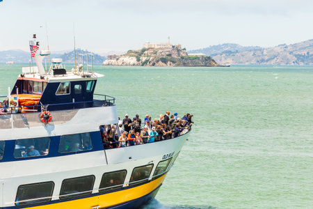 SAN FRANCISCO, CALIFORNIA, USA - July 24, 2018: View of the Alcatraz cruize boat with the tourists going to visit Alcatraz Island. Alcatraz was a federal prison from 1934 to 1963.のeditorial素材