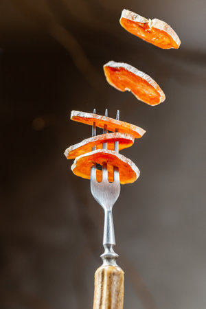 Smoked Chicken meat Sausage sliced flying on the fork. Food levitationの写真素材