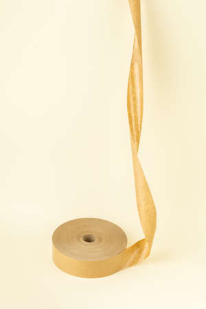 Roll of biodegradable paper sticky tape for delivery service packagingの写真素材